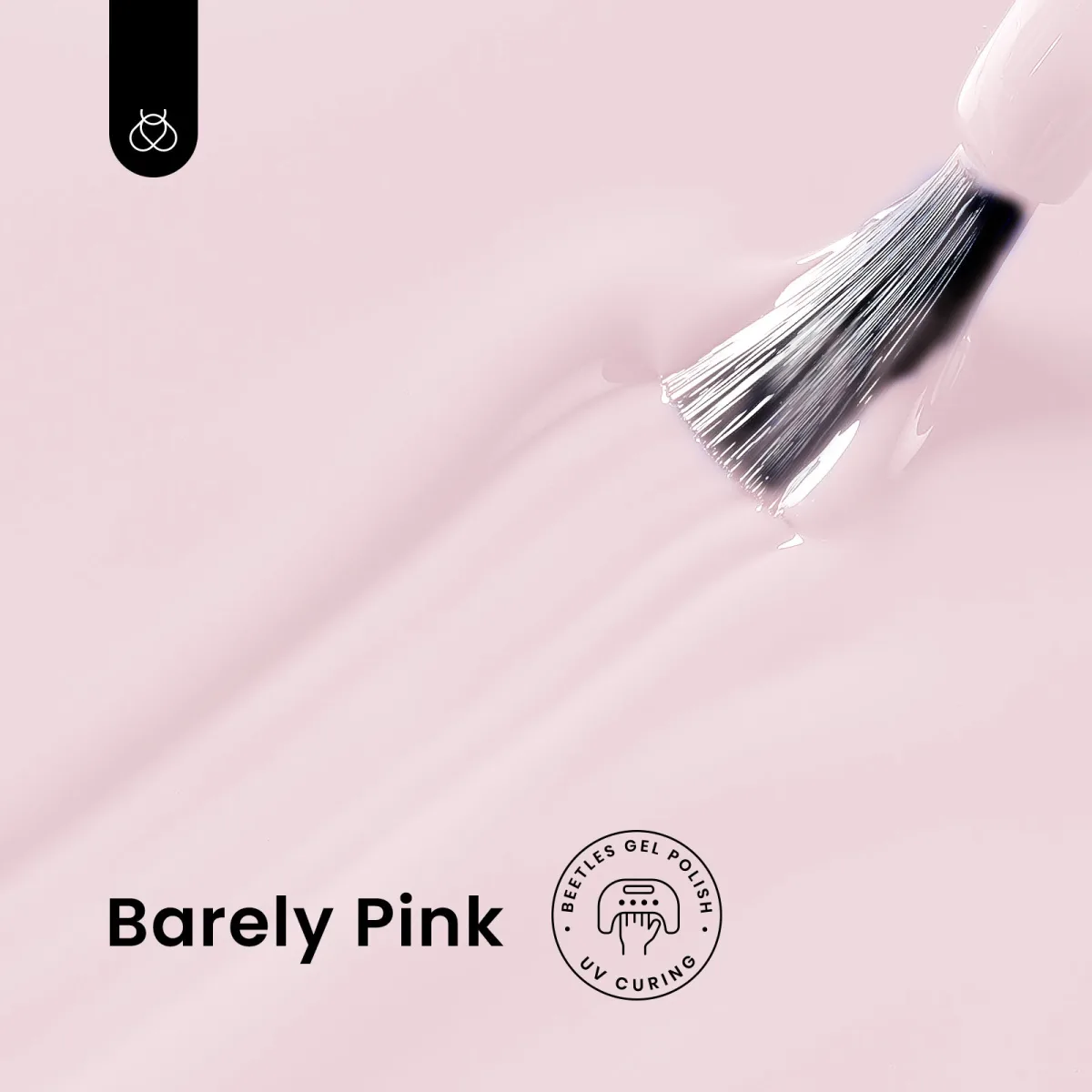 Macro of brush loaded with Barely Pink gel polish on a pink gel swirl background