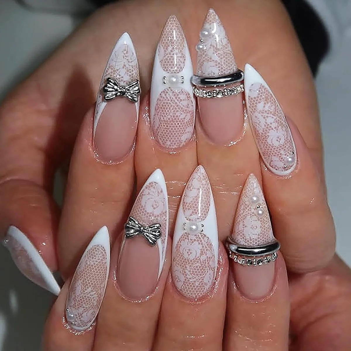 Long stiletto white lace press on nails with silver bows, pearls and rhinestones