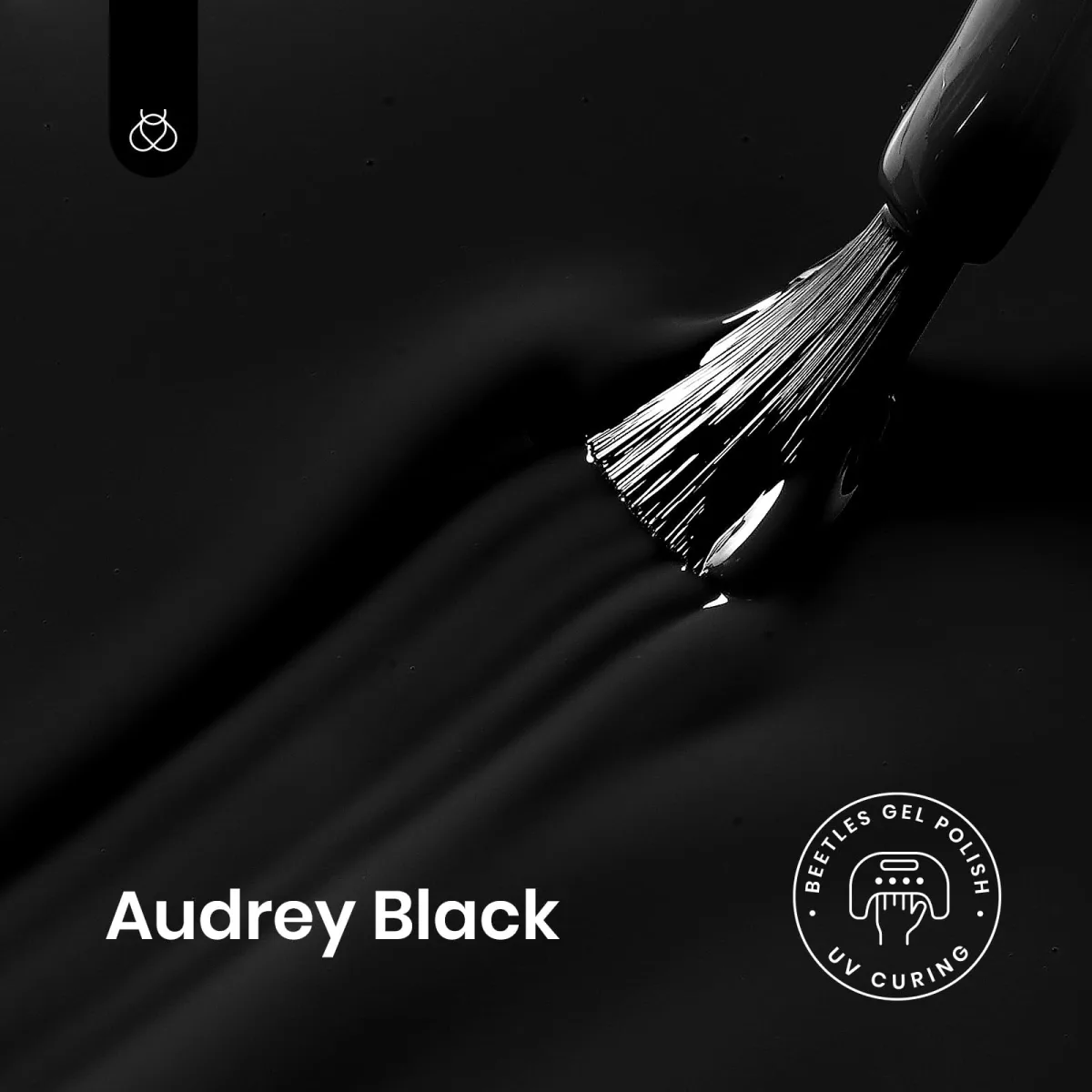 Brush loaded with black gel sweeping across a black gel surface