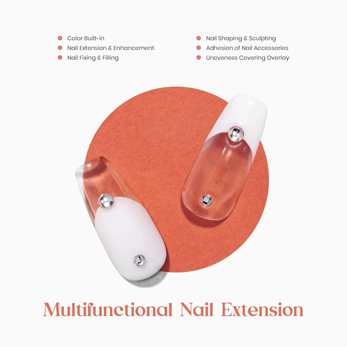Two loose long nail extension samples, each half opaque white and half clear, with a silver bead and a small gem