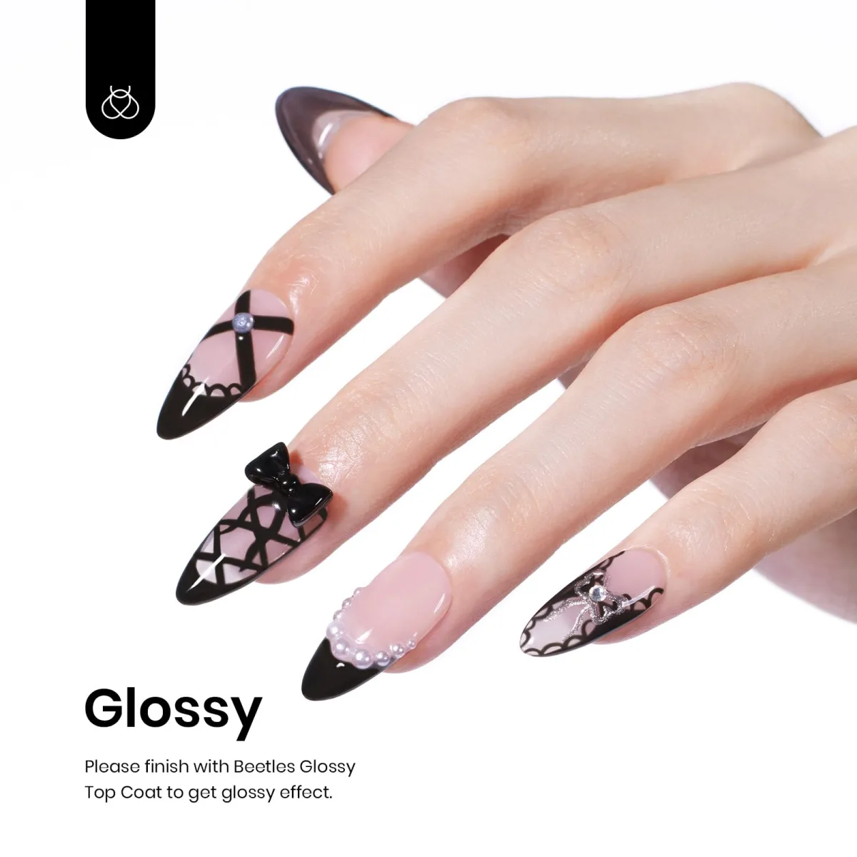 Pale pink almond nails with black French lace art, bows and pearls