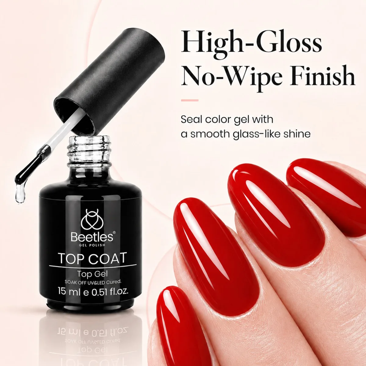 Beetles top coat bottle beside glossy red almond nails with high-gloss no-wipe graphic