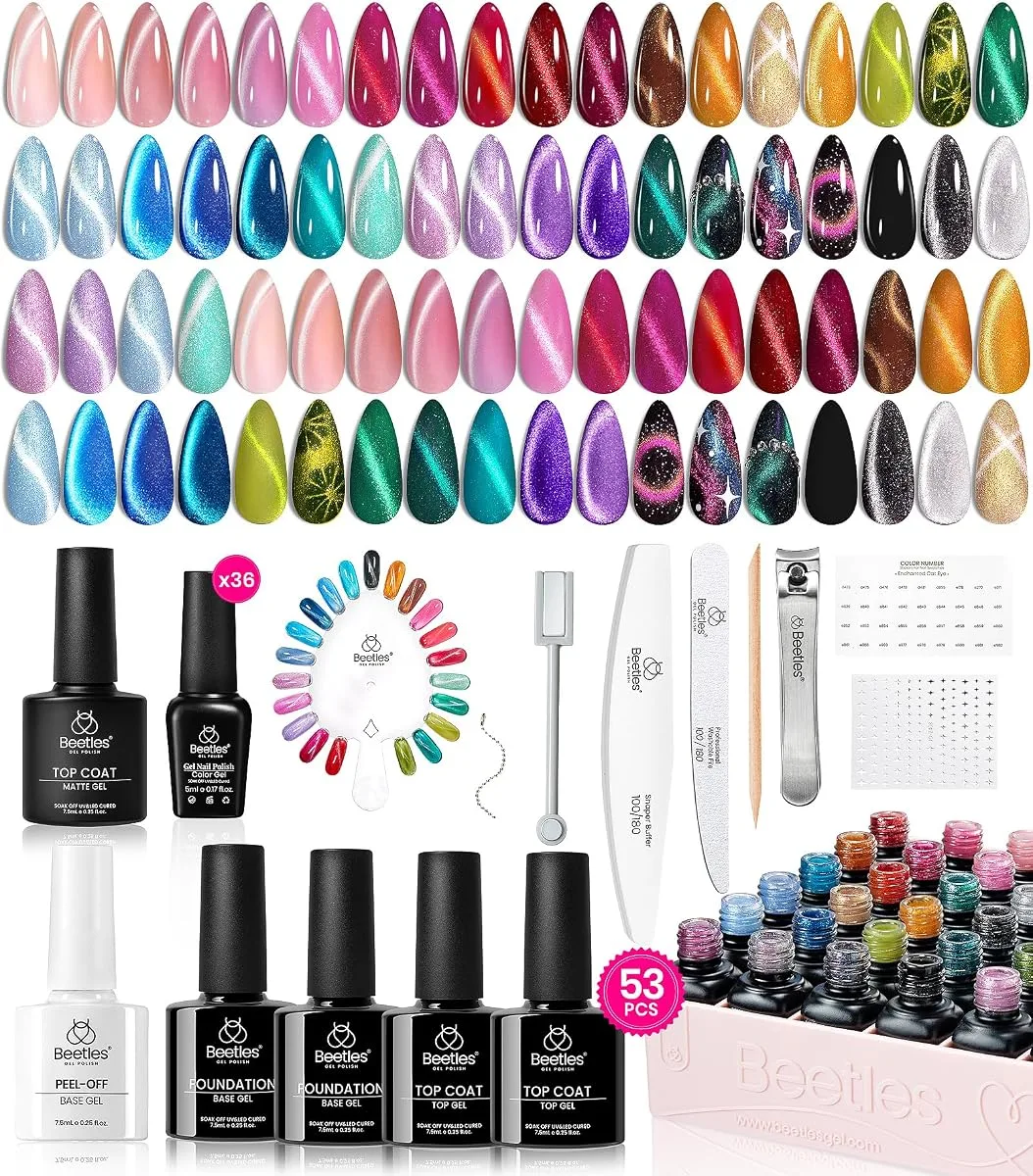 Beetles cat eye gel kit flat lay with 36 colour tips and a 53 piece set with base and top gels, magnet, files and clippers