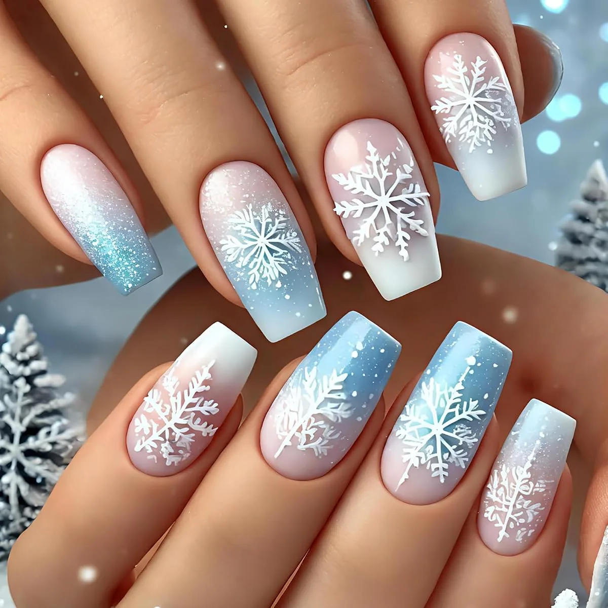 Blue white gradient holiday nails with large white snowflakes on long coffin nails
