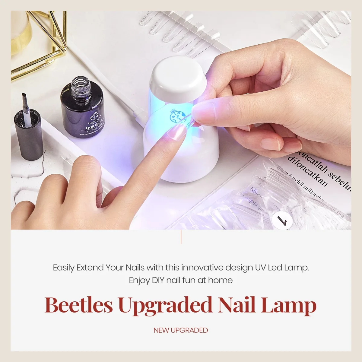 Beetles upgraded mini nail lamp with nail glue bottle and clear coffin tips in a DIY extension scene