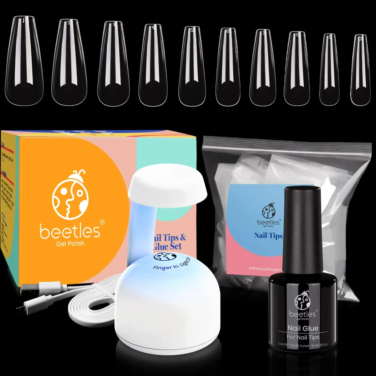 Beetles nail tips and glue set kit lineup: clear coffin tips, retail box, mini UV lamp, nail glue bottle and cable